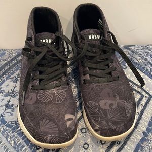 Nobull midrise canvas trainer. Never worn. Black with flower design
